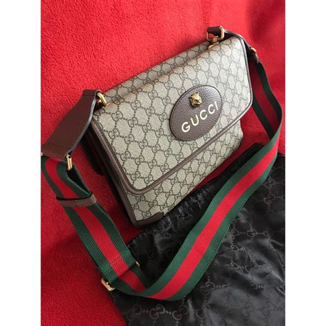 gucci 495654|GG Supreme messenger bag in beige and ebony  .